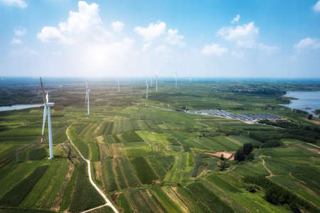 Aerial photography of wind turbines on farmland in Chinaの写真素材