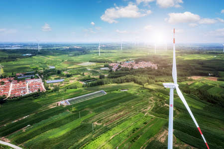 Aerial photography of wind turbines on farmland in Chinaの写真素材