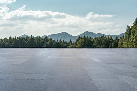 Empty square floor and green forest landscape under the blue sky.の写真素材