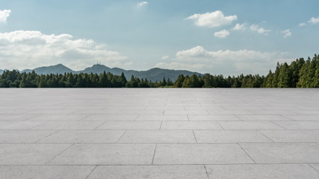 Empty square floor and green forest with mountain natural landscape in the backgroundの写真素材
