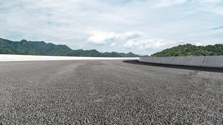 Asphalt road and mountain natural landscape under the blue sky in summerの写真素材