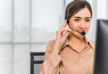 Call center operators. Beautiful asian woman working service consulting clients with headset and...