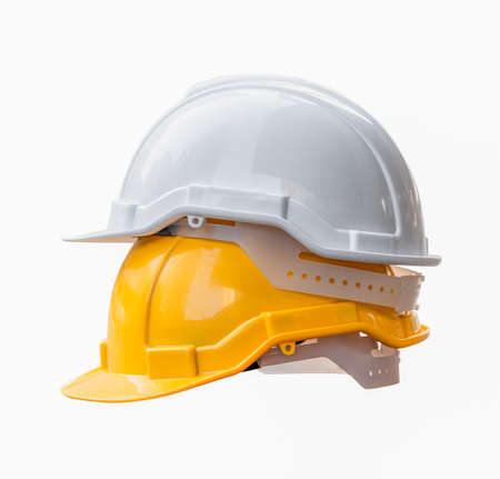 White and yellow hard safety helmet hat for safety project of engineer and worker isolated on white...