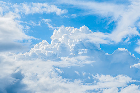 Blue sky and white fluffy clouds for background.