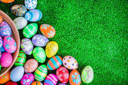 Beautiful multi colorful easter eggs from design and hand painted for festival holiday in wicker...
