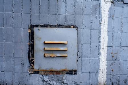 Ventilation house in wall of a paneled floor. With tiles stacked in a row.の写真素材