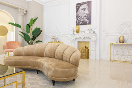 chic luxury interior in an old antique style open-plan apartment decorated with columns and stucco on the wall in pastel colors. tiles on the floor. beige wallsの写真素材