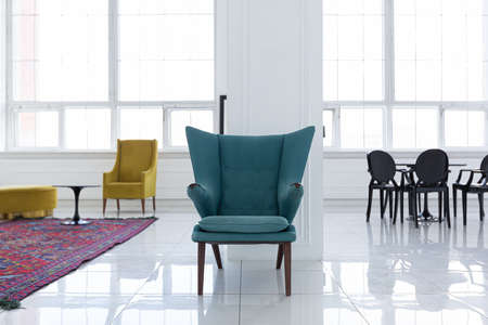 modern fashionable futuristic interior design of a spacious white hall with black and yellow furnitureの写真素材