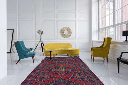 modern fashionable futuristic interior design of a spacious white hall with black and yellow furnitureの写真素材