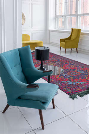 modern fashionable futuristic interior design of a spacious white hall with black and yellow furnitureの写真素材