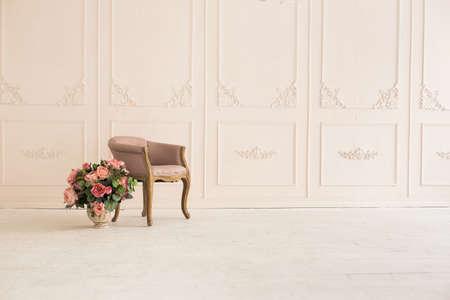 luxury clean bright white interior. a spacious room with sunlight and flowers in vasesの写真素材