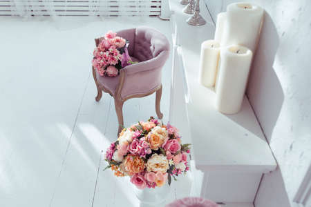 luxury clean bright white interior. a spacious room with sunlight and flowers in vasesの写真素材