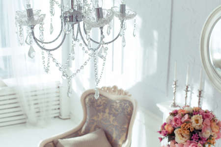 luxury clean bright white interior. a spacious room with sunlight and flowers in vasesの写真素材