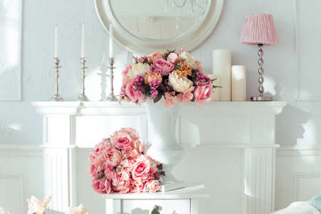 luxury clean bright white interior. a spacious room with sunlight and flowers in vasesの写真素材