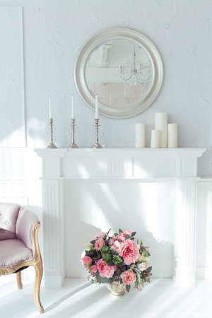 luxury clean bright white interior. a spacious room with sunlight and flowers in vasesの写真素材