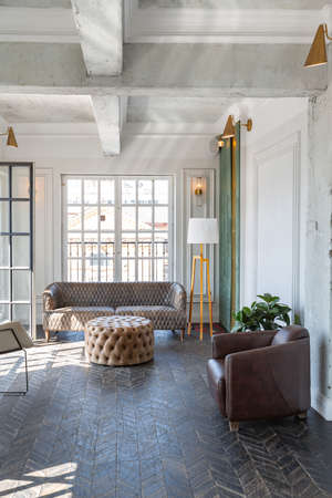 Chic, luxurious guest room design with old-fashioned antique furniture. white walls are decorated...
