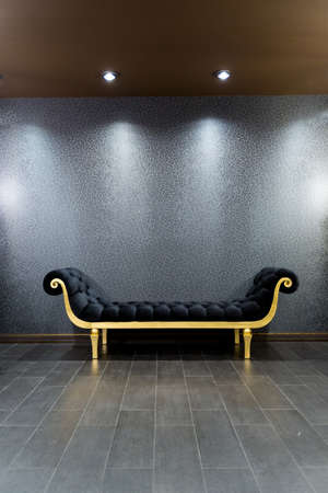 luxurious romantic room in a pompous style in black and gold colors with magnificent furnitureの写真素材