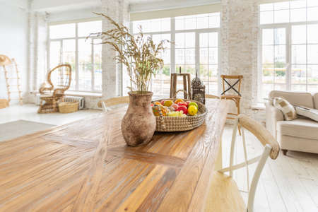 Large spacious room with a trendy loft design of sitting area. huge windows and stylish wicker light...