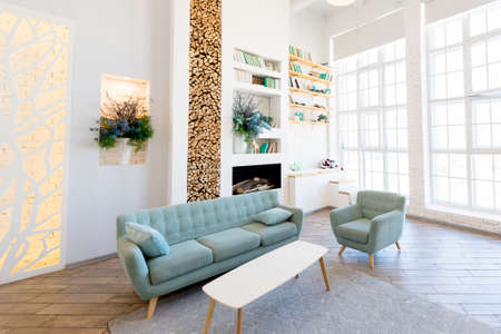Fashionable spacious apartment with a stylish design in green, gray and white pastel colors with big...