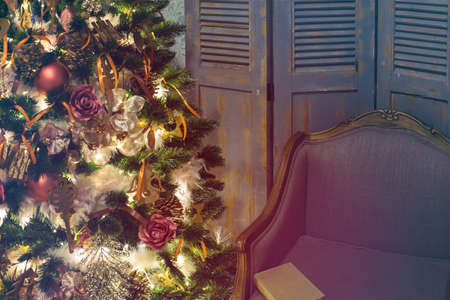 Luxury interior of living room with decorated Christmas tree and gifts on the wooden floorの写真素材