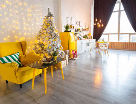 Trendy fashion luxury interior design in Scandinavian style of studio apartment with bright yellow...