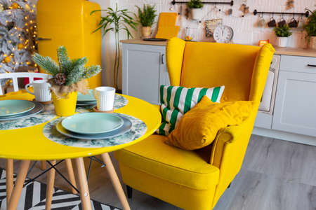 Trendy fashion luxury interior design in Scandinavian style of studio apartment with bright yellow...
