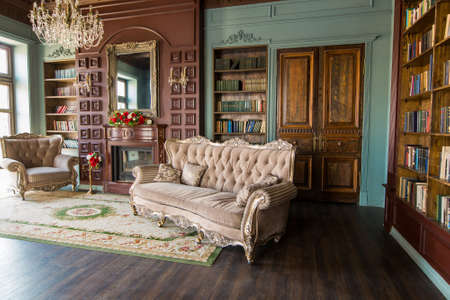 Luxury interior of home library. Sitting room with elegant furniture