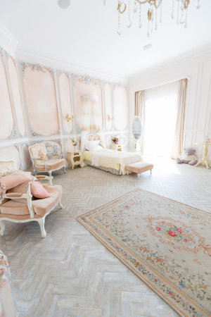Luxurious expensive interior design of the bed room in the old Baroque style in beige colorsの写真素材