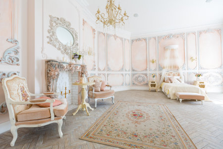 Luxurious expensive interior design of the bed room in the old Baroque style in beige colors