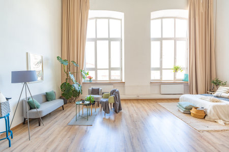 interior of stylish loft. spacious apartment with large windows, parquet on the floor and light walls. closeup view of shelving with different small things for decorationの写真素材