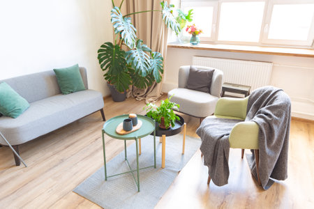 interior of stylish loft. spacious apartment with large windows, parquet on the floor and light...