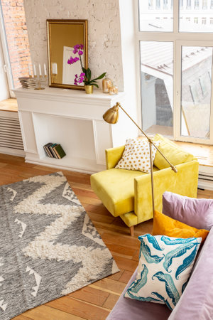 Scandinavian style apartment interior. bright yellow warm colors. wooden flooring. sunlight in large...