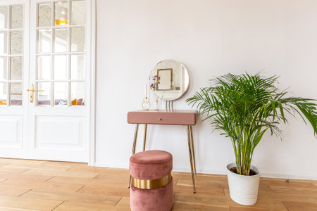 Scandinavian style apartment interior. bright yellow warm colors. wooden flooring. sunlight in large windows.の写真素材