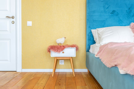 Scandinavian style apartment interior. bright yellow warm colors. wooden flooring. sunlight in large windows.の写真素材