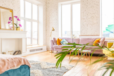 Scandinavian style apartment interior. bright yellow warm colors. wooden flooring. sunlight in large windows.の写真素材