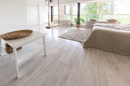 Luxury bedroom design in a rustic cottage in a minimalist style. white walls, panoramic windows, wooden elements of decoration on the ceiling, rope swings in the middle of a spacious room.の写真素材