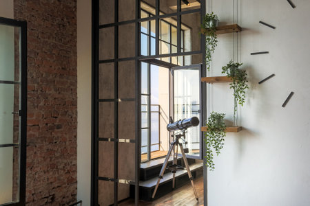 luxury studio apartment with a free layout in a loft style in dark colors. Stylish modern kitchen...
