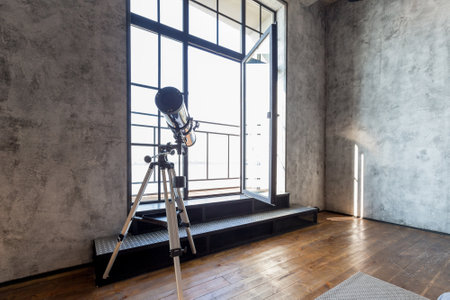 luxury studio apartment with a free layout in a loft style in dark colors. Stylish modern kitchen...