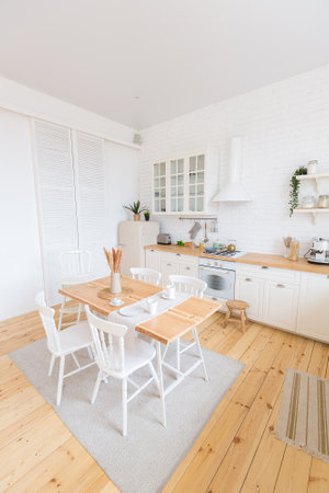cute cozy light interior design of the apartment with a free layout of the kitchen and bedroom...