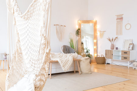 cute cozy light interior design of the apartment with a free layout of the kitchen and bedroom...