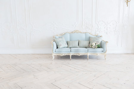 luxurious light interior in the Baroque style. A spacious room with a road chic beautiful furniture,...