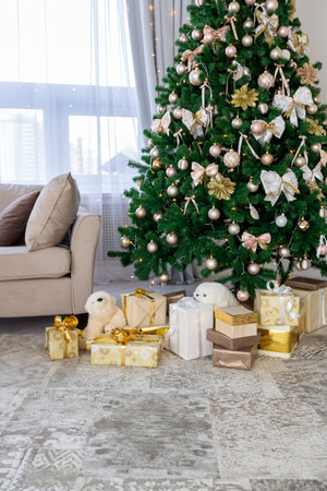 Luxury rich expensive apartment interior in light colors. Stylish contemporary minimalistic design. Full of sun light. A lot of space decorated with Christmas treeの写真素材