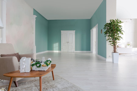 Luxurious and expensive interior of an open-plan apartment in light colors. Stylish modern bedroom with minimal design, dining area and guest space.の写真素材