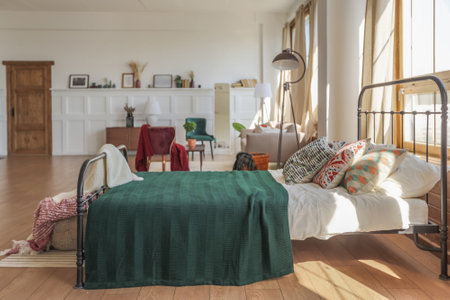 Vintage studio apartment interior in light colors in old style. huge room with large windows with a...