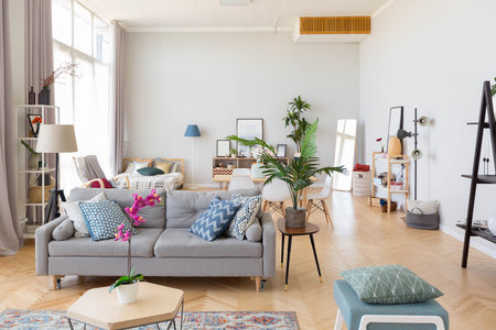 The interior design of the studio apartment in Scandinavian style. A spacious huge room in light colors. stylish expensive luxury furniture.の写真素材