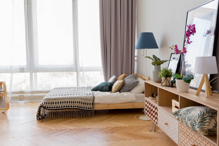 The interior design of the studio apartment in Scandinavian style. A spacious huge room in light...