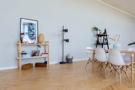 The interior design of the studio apartment in Scandinavian style. A spacious huge room in light...