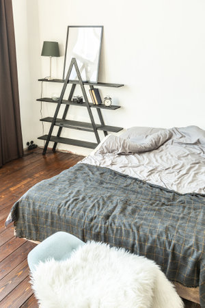 spacious studio apartment decorated with wood and white. Minimalist design with huge windows in the...