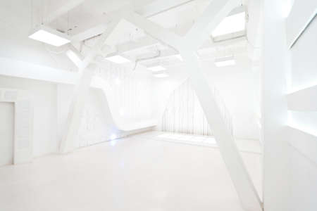 Abstract futuristic empty room interior in white with illumination in the style of a spaceship. geometric decoration on the walls.の写真素材