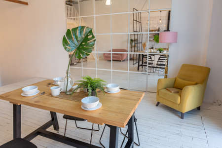 luxury modern design of a cozy small Scandinavian-style studio apartment with white walls, second...